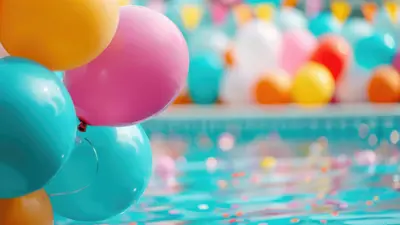 Colourful balloons next to a blue swimming pool