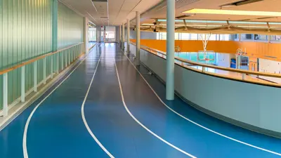 Indoor walking track at the MacBain Community Centre with three walking lanes.